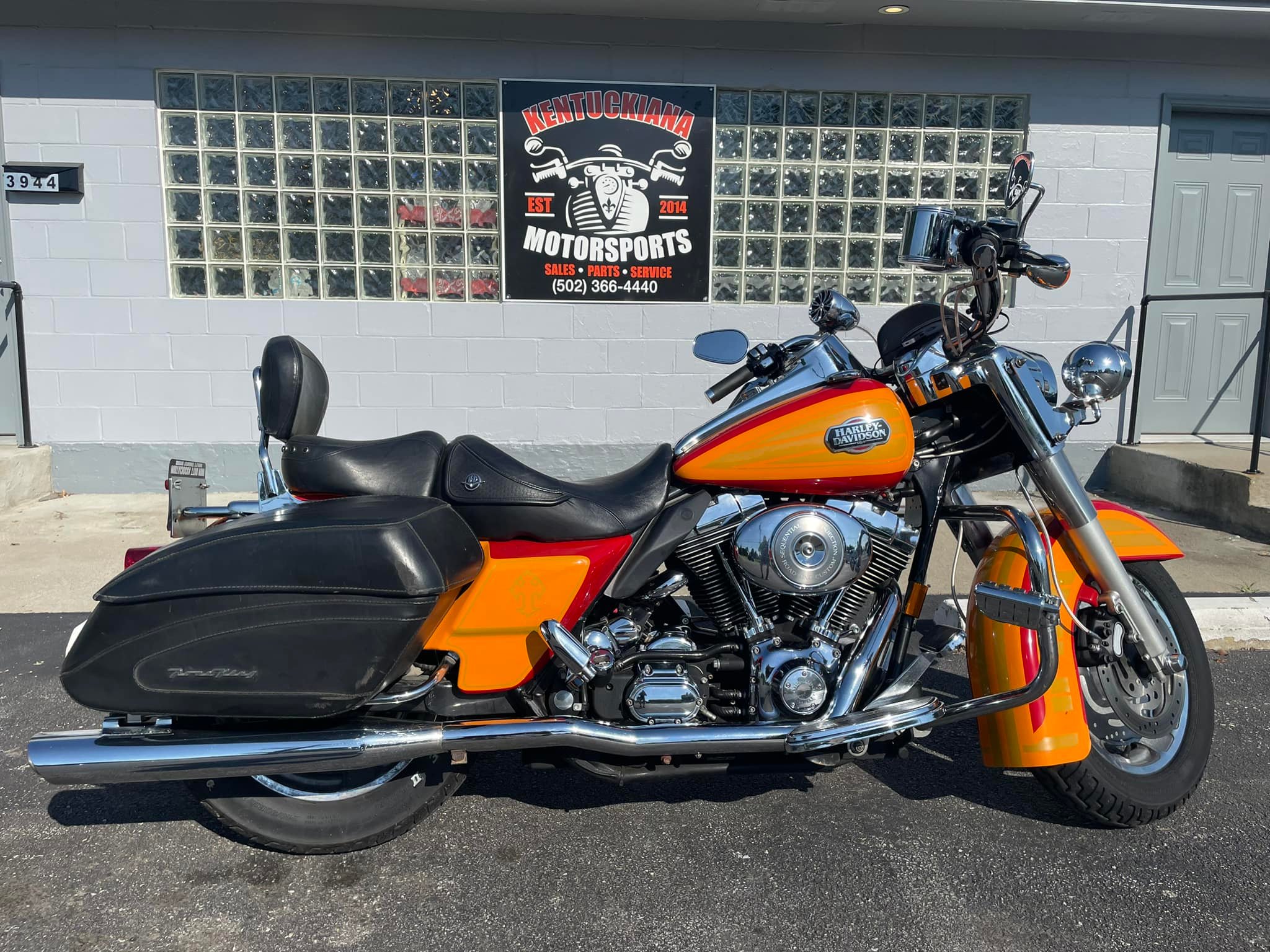 A Motorcycle Stands Parked Before A Building