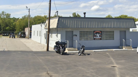 A motorcycle parked in front of a modern building