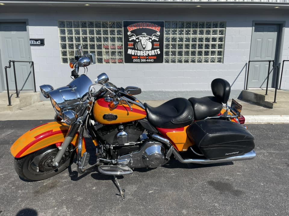 A Motorcycle Parked In Front Of A Modern Building